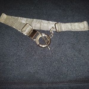 Silver metal mesh adjustable belt.